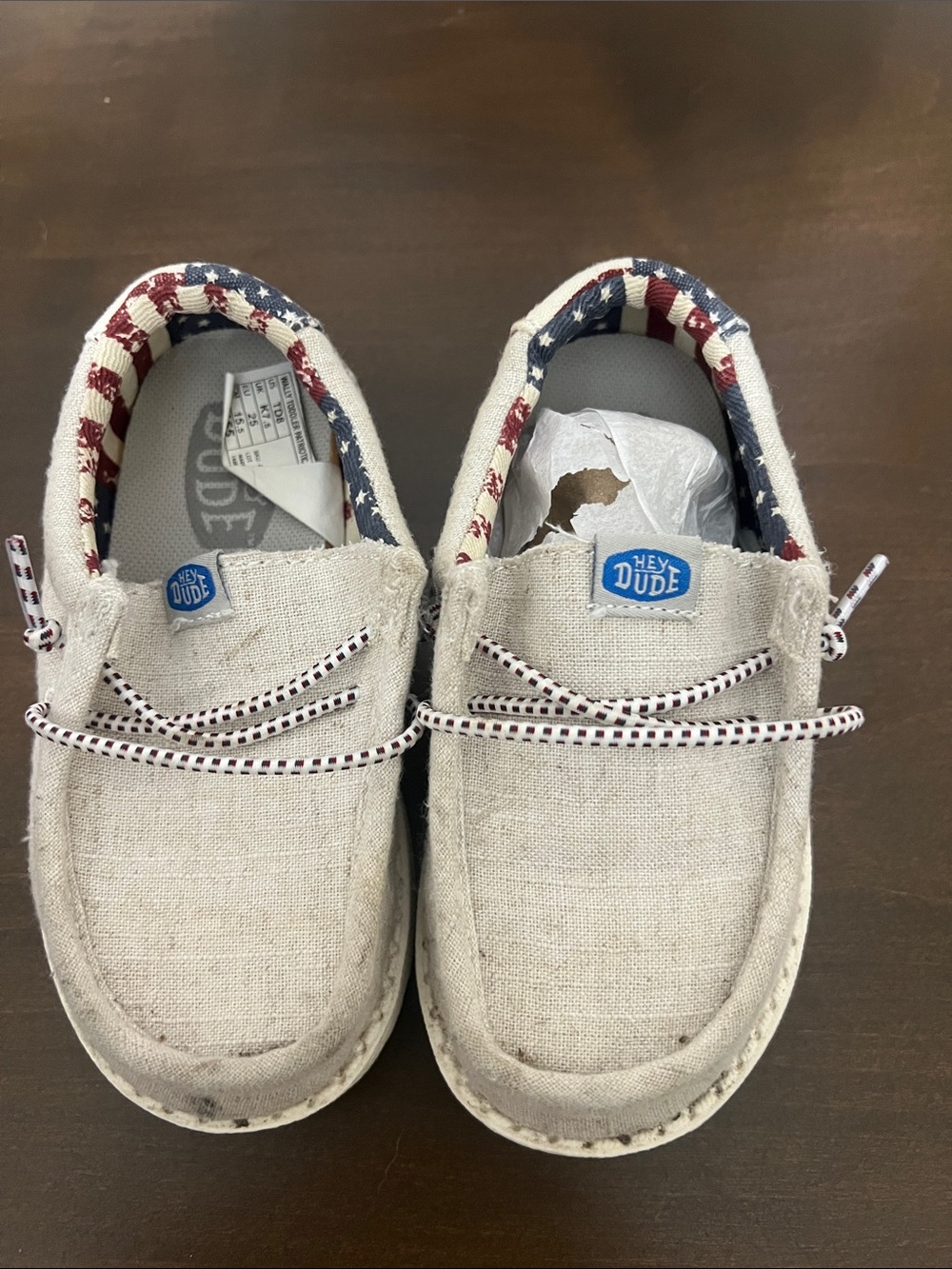 Hey Dude Kids Beige Canvas Slip-On Sneakers with Red, White & Blue Trim